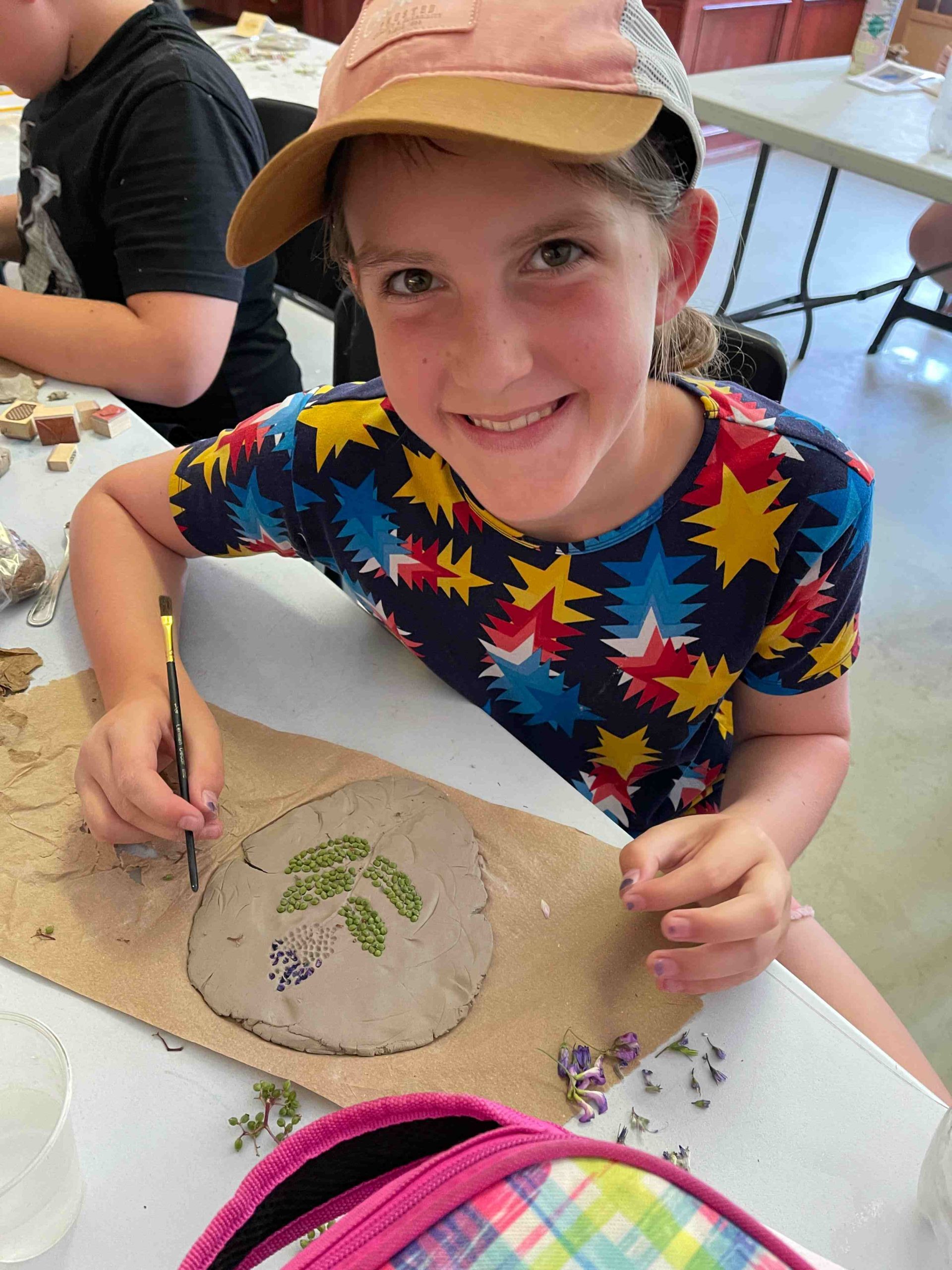 kid working on nature art